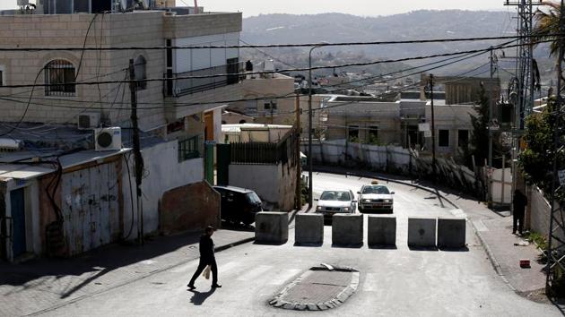 A man walks next to a newly erected concrete barriers at the entrance to Jabel Mukaber, in an area of the West Bank that Israel captured in a 1967 war and annexed to the city of Jerusalem, the morning after a Palestinian rammed his truck into a group of Israeli soldiers on a popular promenade in Jerusalem. (REUTERS) A man walks next to a newly erected concrete barriers at the entrance to Jabel Mukaber, in an area of the West Bank that Israel captured in a 1967 war and annexed to the city of Jerusalem, the morning after a Palestinian rammed his truck into a group of Israeli soldiers on a popular promenade in Jerusalem. (REUTERS)