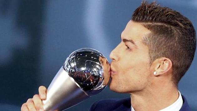 Cristiano Ronaldo won FIFA’s player of the year award for the fourth time on Monday, beating his old rival Lionel Messi, who was pulled out of the ceremony only a few hours earlier by his club Barcelona(Reuters)