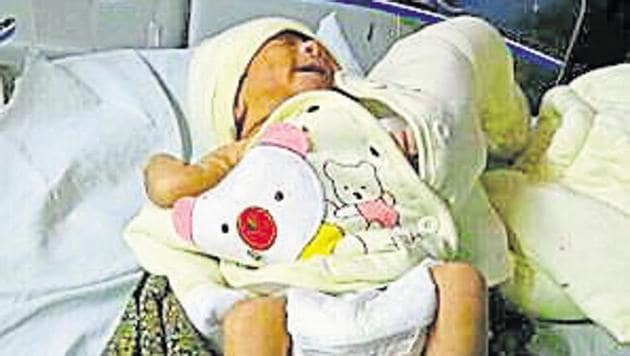 Five families from Gurgaon and Manesar had come forward to adopt a two-day-old abandoned baby girl (above) near Shikohpur village and contacted the media and civic authorities for the same, but official procedures are proving a hindrance for both the seekers as well as babies. (HT Photo) Five families from Gurgaon and Manesar had come forward to adopt a two-day-old abandoned baby girl (above) near Shikohpur village and contacted the media and civic authorities for the same, but official procedures are proving a hindrance for both the seekers as well as babies. (HT Photo)