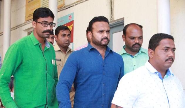 Police take Congress MLA Jaykumar Gore (centre) to court in Satara. (Raju Gore) Police take Congress MLA Jaykumar Gore (centre) to court in Satara. (Raju Gore)