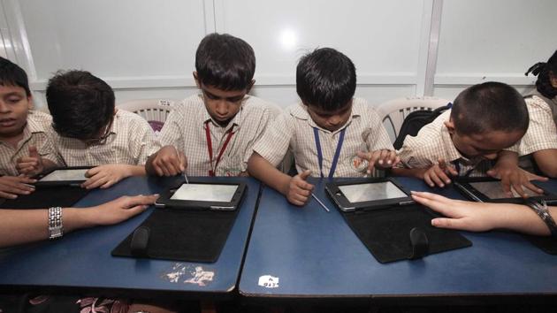 India, Mumbai...June 19, 2012..Disable children from Little Angels School, Khar West, Mumbai, India learn on the tablets in their school on Tuesday, June 19, 2012...Story by Namrata....Photo by Kalpak Pathak / Hindustan Times.(HT file photo)