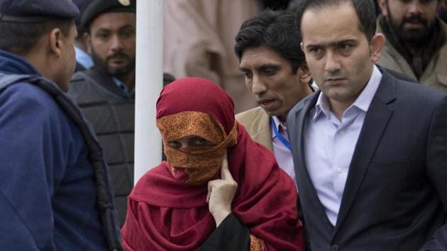The wife of a judge, accused of torturing her 10-year-old maid, outside the Supreme Court in Islamabad, Pakistan.(AP file photo)