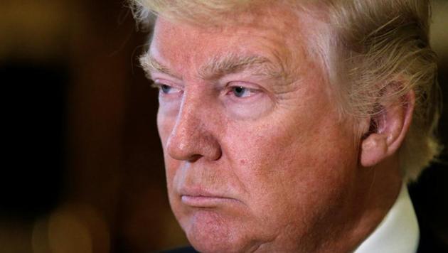 US president-elect Donald Trump listens to questions from reporters in the lobby at Trump Tower in New York. (Reuters Photo) US president-elect Donald Trump listens to questions from reporters in the lobby at Trump Tower in New York. (Reuters Photo)