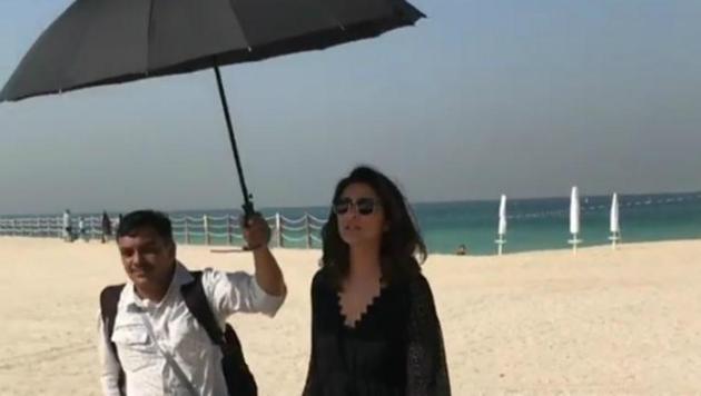 The video showed a man holding Parineeti’s umbrella and carrying multiple bags as she strolled along the beach. The video showed a man holding Parineeti’s umbrella and carrying multiple bags as she strolled along the beach.