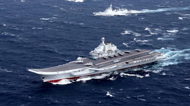 China's Liaoning aircraft carrier with accompanying fleet conducts a drill in an area of South China Sea. (Reuters File Photo) China's Liaoning aircraft carrier with accompanying fleet conducts a drill in an area of South China Sea. (Reuters File Photo)