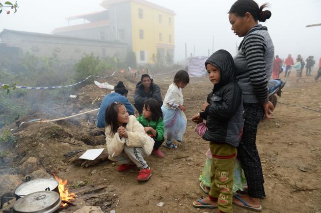 Refugees from Myanmar cooking outside a temporary shelter across the border in Manghai, in southwest China's Yunnan province. (AFP File Photo) Refugees from Myanmar cooking outside a temporary shelter across the border in Manghai, in southwest China's Yunnan province. (AFP File Photo)
