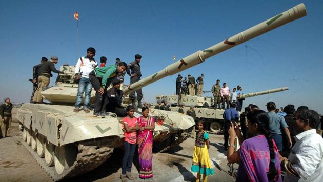 Visitors take pictures with the Indian Army, Corps of Army Air Defence (AAD) tankers during the 24th Raising Day at KK Ranges Ahmednagar in Pune on Wednesday, January 10, 2017. (HT PHOTO)