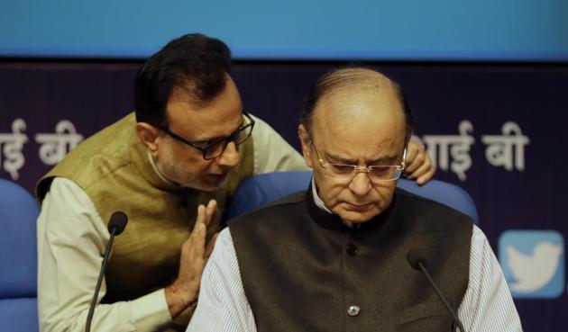 Indian Revenue Secretary Hasmukh Adhia, left, talks to Indian Finance Minister Arun Jaitley prior to a press conference. (AP) Indian Revenue Secretary Hasmukh Adhia, left, talks to Indian Finance Minister Arun Jaitley prior to a press conference. (AP)
