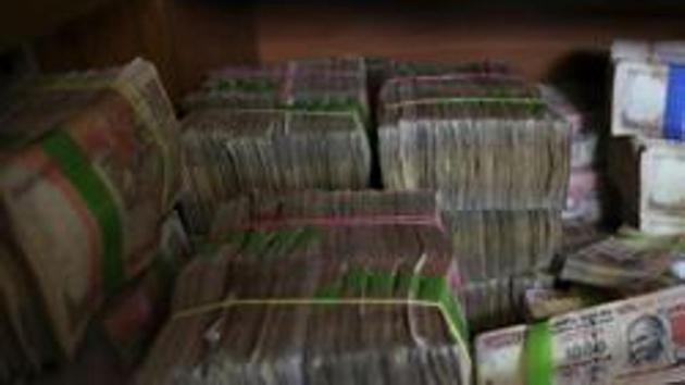 File photo of discontinued Indian currency notes of Rs 1,000 denomination seen after they were deposited by people at a bank in Bengaluru. (AP) File photo of discontinued Indian currency notes of Rs 1,000 denomination seen after they were deposited by people at a bank in Bengaluru. (AP)