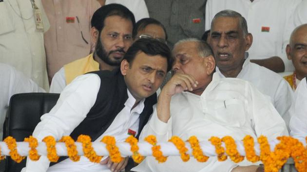 File photo of Uttar Pradesh chief minister Akhilesh Yadav with Samajwadi Party patriarch Mulayam Singh Yadav in Lucknow.(HT Photo)