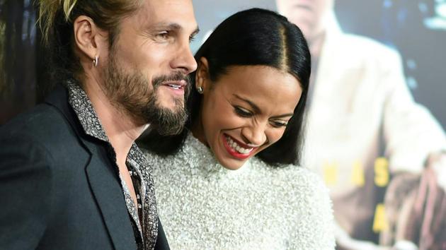 Artist Marco Perego and actor Zoe Saldana arrive for the for the world premiere of Warner Bros. Live By Night. (AFP) Artist Marco Perego and actor Zoe Saldana arrive for the for the world premiere of Warner Bros. Live By Night. (AFP)