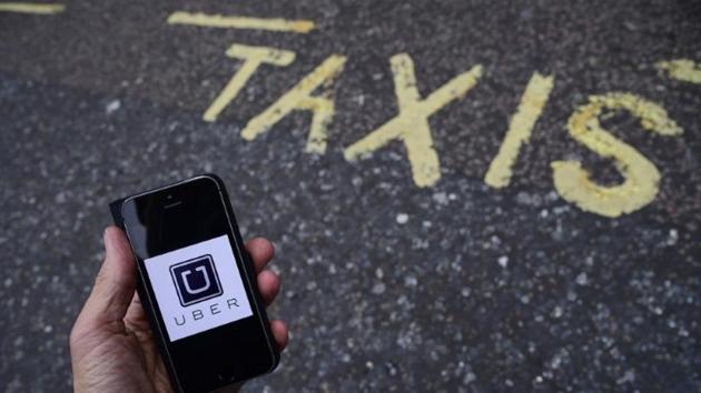 A photo illustration shows the Uber app logo displayed on a mobile. (Reuters) A photo illustration shows the Uber app logo displayed on a mobile. (Reuters)