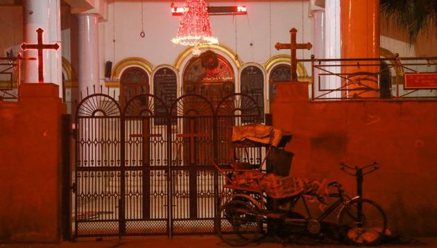 IN GOD’S LIGHT: A rickshaw puller sleeps at the door outside Central Baptist Church in Chandni Chowk.  (AMAL KS/HT PHOTO) 