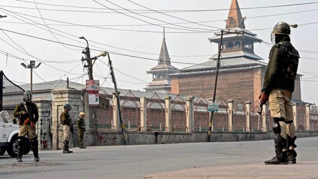 CRPF jawans stand guard during curfew outside Jamia Masjid in downtown Srinagar. (PTI) CRPF jawans stand guard during curfew outside Jamia Masjid in downtown Srinagar. (PTI)