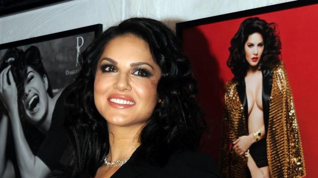 Sunny Leone poses in front of her picture. (AFP) Sunny Leone poses in front of her picture. (AFP)