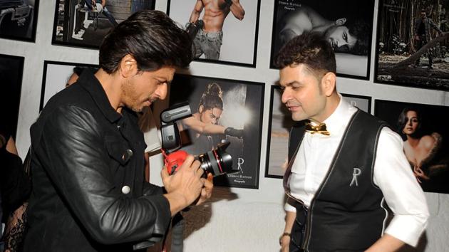Shah Rukh Khan (L) poses with photographer Dabboo Ratnani as he attends the launch of the latter’s ‘Celebrity Calendar 2017’ in Mumbai. (AFP)