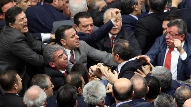 Lawmakers from ruling AK Party and the main opposition Republican People's Party (CHP) scuffle during a debate on the proposed constitutional changes at the Turkish Parliament in Ankara. (Reuters) Lawmakers from ruling AK Party and the main opposition Republican People's Party (CHP) scuffle during a debate on the proposed constitutional changes at the Turkish Parliament in Ankara. (Reuters)