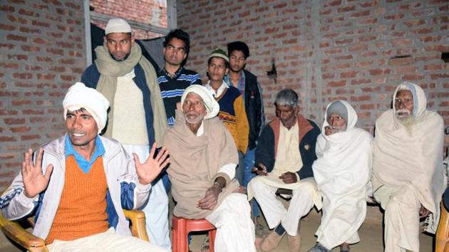 Saleem (white turban) holding a meeting at his house.(HT Photo)