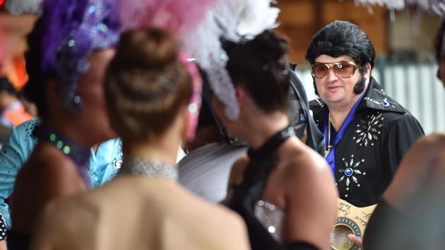 Elvis fans wait at Central station to board a train to take them to The Parkes Elvis Festival from Sydney on Thursday. (AFP) Elvis fans wait at Central station to board a train to take them to The Parkes Elvis Festival from Sydney on Thursday. (AFP)