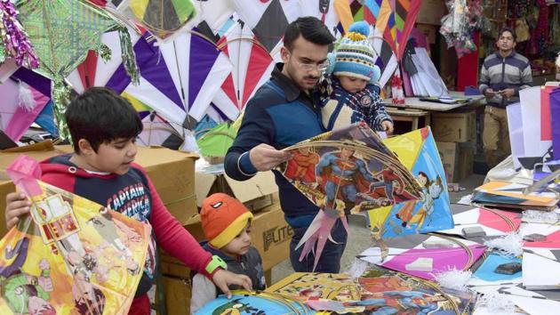 City resident selecting kites on the occasion of Lohri festival in Amritsar on Friday. (Gurpreet Singh/HT Photo)