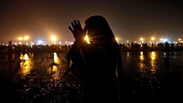 A pilgrim offers prayers after taking a dip in the Ganges river ahead of the one-day festival of Makar Sankranti at Sagar Island, south of Kolkata. (Rupak De Chowdhuri / REUTERS) A pilgrim offers prayers after taking a dip in the Ganges river ahead of the one-day festival of Makar Sankranti at Sagar Island, south of Kolkata. (Rupak De Chowdhuri / REUTERS)
