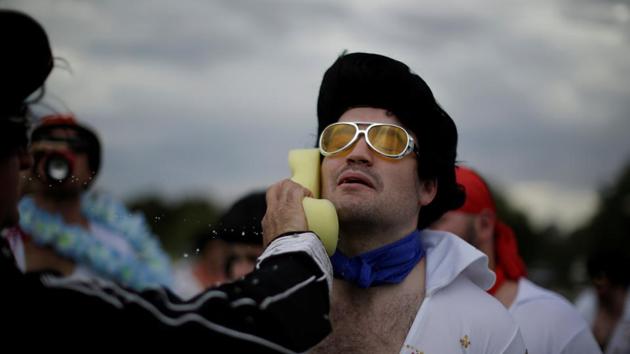 An amateur rugby player dressed as Elvis Presley from the Blue Suede Shoes team gets a wet sponge-down during a break in their rugby union game against the Reddy Teddies during the 25th annual Parkes Elvis Festival in the rural Australian town of Parkes, west of Sydney, Australia. (REUTERS) An amateur rugby player dressed as Elvis Presley from the Blue Suede Shoes team gets a wet sponge-down during a break in their rugby union game against the Reddy Teddies during the 25th annual Parkes Elvis Festival in the rural Australian town of Parkes, west of Sydney, Australia. (REUTERS)