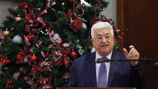 Palestinian president Mahmud Abbas during a Christmas lunch with members of the Christian Orthodox community on January 6, 2017, in Beit Sahur, near the West Bank city of Bethlehem. Abbas has said that Palestenians may consider ‘reversing’ Israel recognition if US president-elect Trump moves embassy to Jerusalem. (AFP) Palestinian president Mahmud Abbas during a Christmas lunch with members of the Christian Orthodox community on January 6, 2017, in Beit Sahur, near the West Bank city of Bethlehem. Abbas has said that Palestenians may consider ‘reversing’ Israel recognition if US president-elect Trump moves embassy to Jerusalem. (AFP)