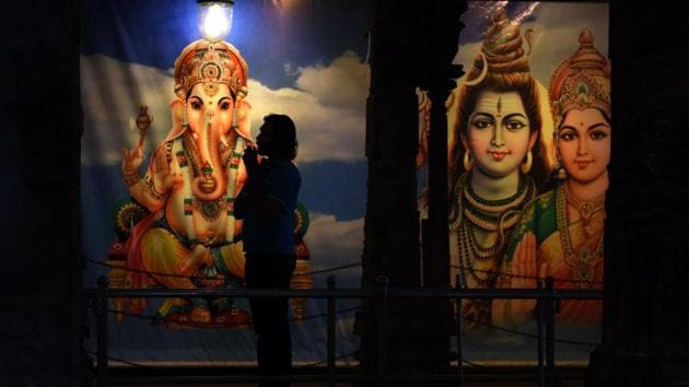 A Sri Lankan Hindu devotee offers prayers at a Hindu temple in Colombo on Saturday. Hindus in Sri Lanka are celebrating the Thai Pongal festival, which worships and offers thanks to the Sun god. (AFP)