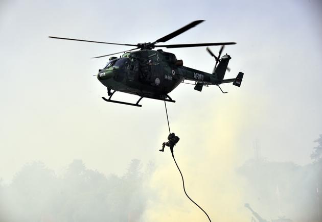 Army soldiers demonstrate their war skills during the Army Day parade at Delhi Cantt in New Delhi on Sunday. (Arvind Yadav/HT PHOTO)
