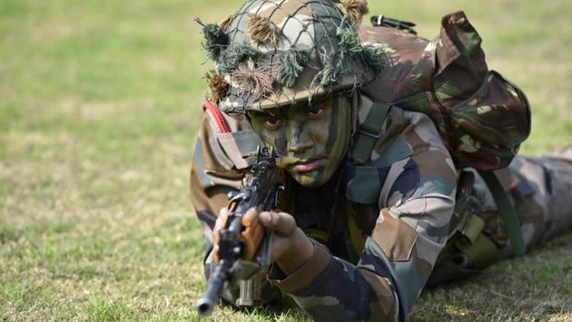 Army soldiers display their war skills during the Army Day parade at Delhi Cantt in New Delhi on Sunday. (Arvind Yadav/HT PHOTO)