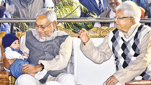 Bihar chief minister Nitish Kumar with the grandson of RJD leader Lalu Prasad. (AP Dube/ Hindustan Times) Bihar chief minister Nitish Kumar with the grandson of RJD leader Lalu Prasad. (AP Dube/ Hindustan Times)