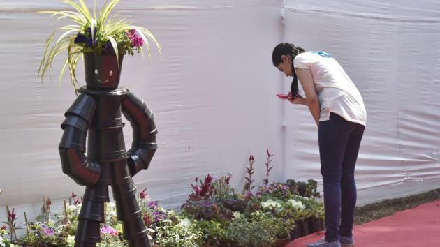 The juxtaposition of nature and technology takes on a creative spin with this robot exhibition made out of pots. (Anshuman Poyrekar/HT PHOTO) 