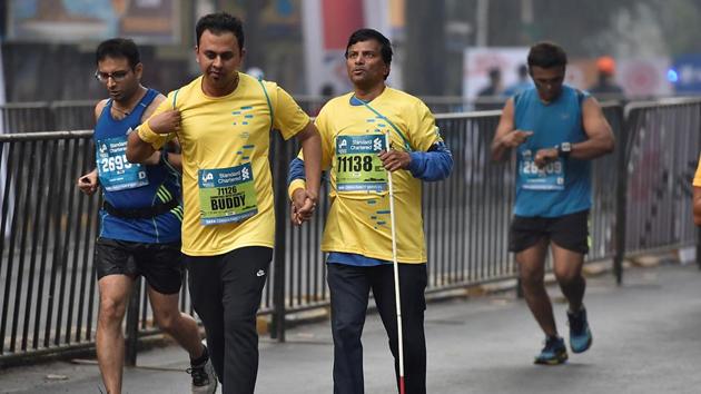 A visually impaired person participates in Mumbai Marathon.  (Arijit Sen/HT PHOTO) 