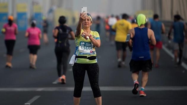 Mumbai, India - Jan. 14, 2017: A Participant takes selfie  during the 2017 Mumbai Marathon at Bandra-worli Sealink. (Satish Bate/HT PHOTO) 