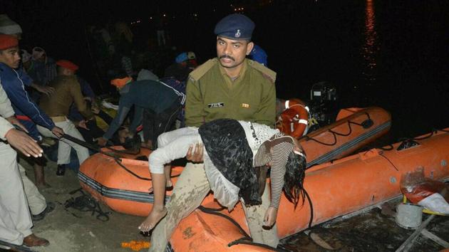 SDRF team fishes out a body of girl from the Ganga river near Patna where a boat capsized downing at least 23 people. (PTI Photo) SDRF team fishes out a body of girl from the Ganga river near Patna where a boat capsized downing at least 23 people. (PTI Photo)