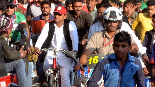 UP chief minister Akhilesh Yadav rides a bicycle after opening the Inner Ring Road, near Agra. In a morale booster, he was allotted the SP’s bicycle symbol by the Election Commission on Monday.(PTI File Photo)