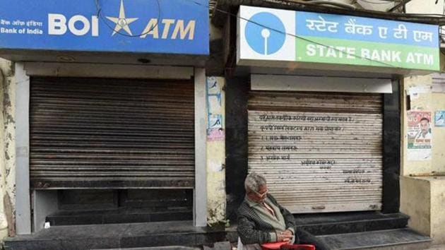 A man takes a nap outside the ATM which was closed due to unavailability of cash. (HT File Photo) A man takes a nap outside the ATM which was closed due to unavailability of cash. (HT File Photo)
