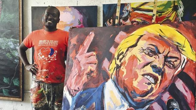 Kenyan artist Evans Yegon displays one of his paintings of Donald Trump. (AP File) Kenyan artist Evans Yegon displays one of his paintings of Donald Trump. (AP File)