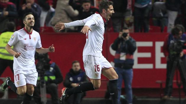 Sevilla's Stevan Jovetic (right) celebrates after scoring the late-winner against Real Madrid C.F. in their La Liga match at the Ramon Sanchez Pizjuan stadium, on Sunday. Cristiano Ronaldo’s penalty put Madrid in front, but Sergio Ramos’s own goal levelled before Jovetic curled home from 25 yards. (AP) Sevilla's Stevan Jovetic (right) celebrates after scoring the late-winner against Real Madrid C.F. in their La Liga match at the Ramon Sanchez Pizjuan stadium, on Sunday. Cristiano Ronaldo’s penalty put Madrid in front, but Sergio Ramos’s own goal levelled before Jovetic curled home from 25 yards. (AP)