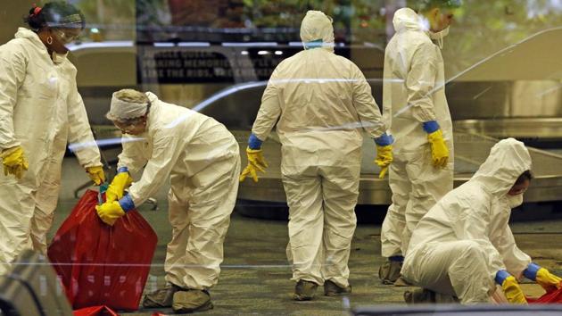 A hazmat crew cleans up baggage claim Terminal Two at Fort Lauderdale-Hollywood International Airport Terminal the day after multiple people were shot. (AP File Photo) A hazmat crew cleans up baggage claim Terminal Two at Fort Lauderdale-Hollywood International Airport Terminal the day after multiple people were shot. (AP File Photo)