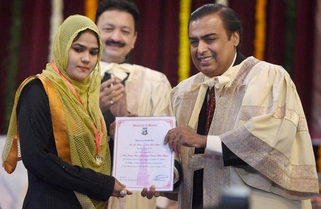Mukesh Ambani, chairman and MD of Reliance Industries, felicitating a student during the annual convocation of Mumbai University. (PTI) Mukesh Ambani, chairman and MD of Reliance Industries, felicitating a student during the annual convocation of Mumbai University. (PTI)