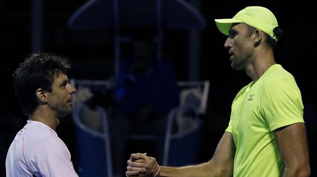 Ivo Karlovic (right) is congratulated by Horacio Zeballos after their Australian Open Rd 1 match. (AP) Ivo Karlovic (right) is congratulated by Horacio Zeballos after their Australian Open Rd 1 match. (AP)
