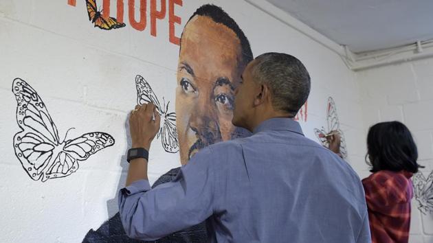 President Barack Obama and first lady Michelle Obama help paint a mural of Martin Luther King, Jr., in the community room of the Jobs Have Priority Naylor Road Family Shelter in Washington. The mural,"Wall of Hope" was created by artist Omatayo Akinbolajo and features a painting of Martin Luther King Jr. (Susan Walsh/AP) President Barack Obama and first lady Michelle Obama help paint a mural of Martin Luther King, Jr., in the community room of the Jobs Have Priority Naylor Road Family Shelter in Washington. The mural,"Wall of Hope" was created by artist Omatayo Akinbolajo and features a painting of Martin Luther King Jr. (Susan Walsh/AP)