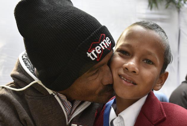 Eleven-year-old Mohan Sethy from Odisha with his father in New Delhi at the 2016 National Bravery Awards. Sethy saved a friend from drowning in a river. (Mohd Zakir/HT Photo)