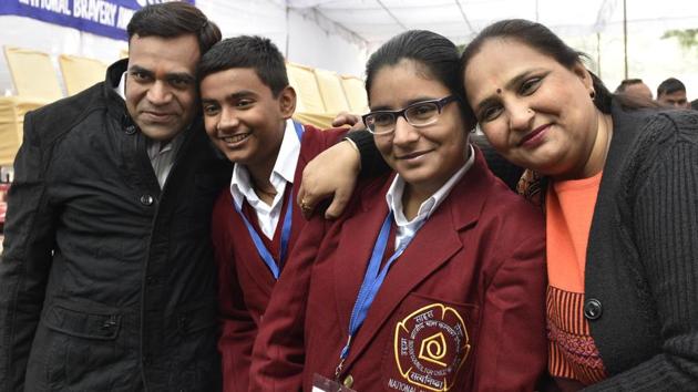 Akshita and her brother Akshit Sharma from Delhi, with their parents, won the National Bravery Award for apprehending thieves who had broken into their home. (Mohd Zakir/HT Photo)