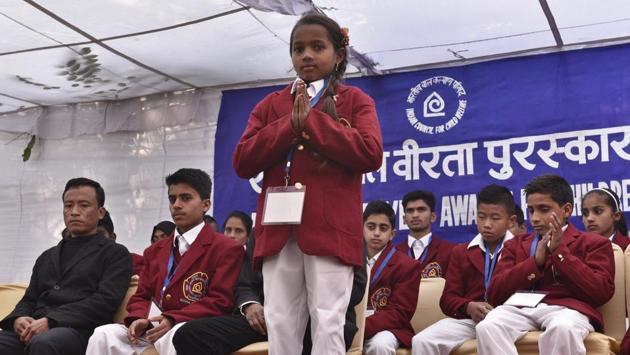 Eight-year-old Kumari Neelam Dhruv from Chhattisgarh won an award for pulling her friend to safety from drowning in a pond at her village. (Mohd Zakir/HT Photo)