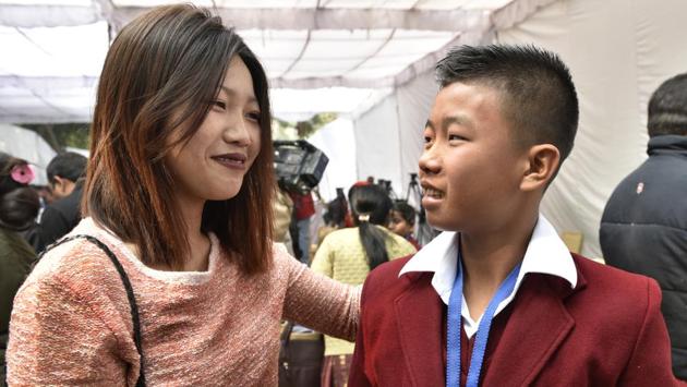 Fourteen-year-old Moirangthem Sadananda Singh at the function with his sister. He won an award for saving his mother from electrocution at home. (Mohd Zakir/HT Photo)