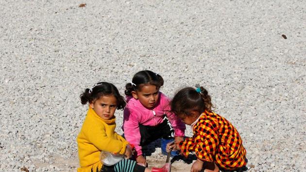 Displaced Iraqi children who fled the Islamic State stronghold of Mosul play at Khazer camp,on January 17. (Reuters Photo) Displaced Iraqi children who fled the Islamic State stronghold of Mosul play at Khazer camp,on January 17. (Reuters Photo)