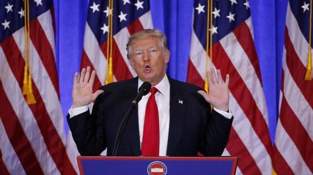 US President-elect Donald Trump speaks during a news conference in the lobby of Trump Tower in Manhattan.