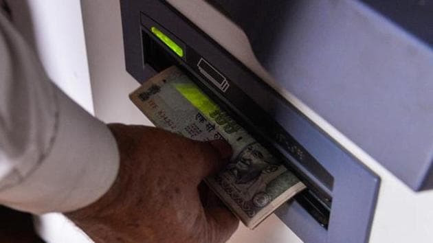 A man withdraws money from a mobile bank ATM . The formal banking industry, with its branches and ATM kiosks has traditionally not been able to adequately penetrate the rural market or leverage the full scope of digital banking (AFP) A man withdraws money from a mobile bank ATM . The formal banking industry, with its branches and ATM kiosks has traditionally not been able to adequately penetrate the rural market or leverage the full scope of digital banking (AFP)